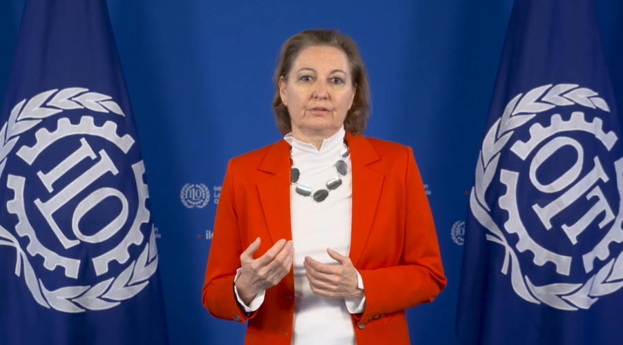 Laura Thompson, ADG, ILO Woman standing in front of ILO backdrop