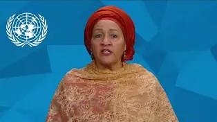 Woman in front of a blue background