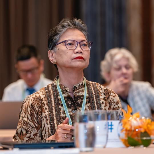 Woman sitting in a conference