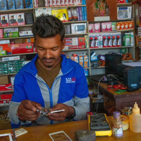 A man repairing a mobile 
