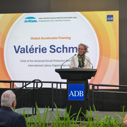 Woman standing at the podium