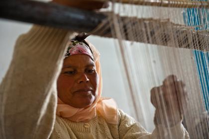 A woman in training center for production of local handicrafts