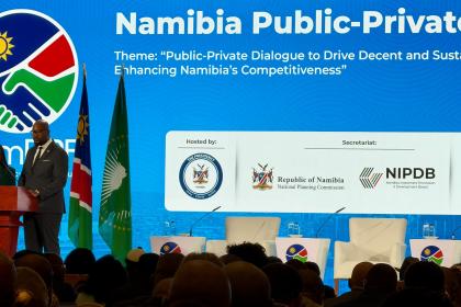 Women and men at a dais 