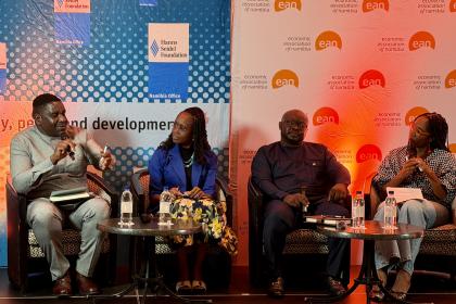 Women and men at a dais 