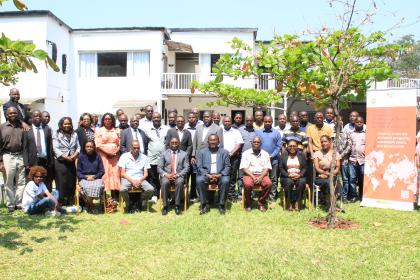 Women and men in a group photo outside 
