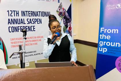 Woman speaking into a mic