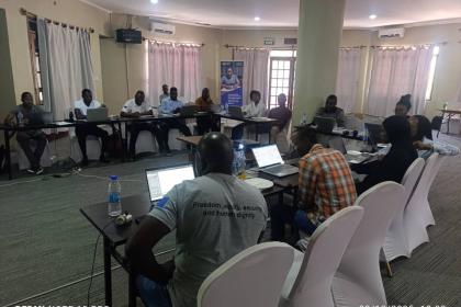 Women and men sitting for a roundtable discussion
