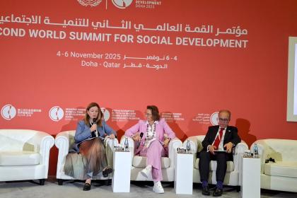 Women and men at a dais 