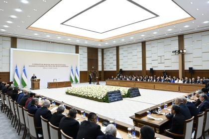 Man addressing a large conference hall