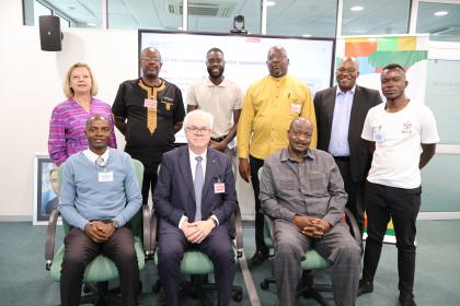 Group photo of men and women sitting together