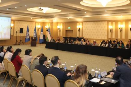 Wide shot of a big roundtable conference 