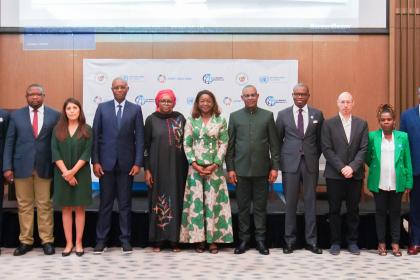 Women and men standing together for a group photo
