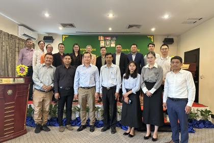Women and men standing together for a group photo