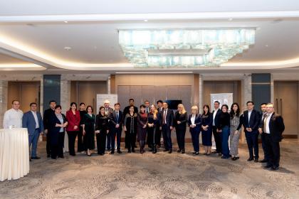Women and men standing together for a group photo