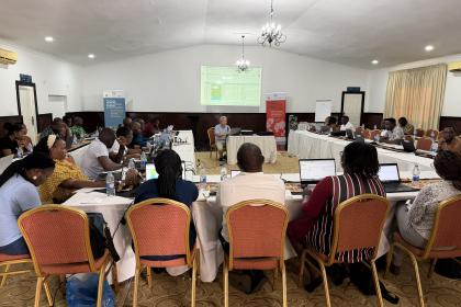 Women and men sitting for a workshop