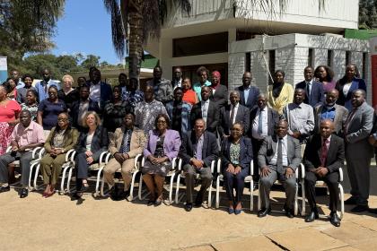 A group photo of the event participants out in the sun
