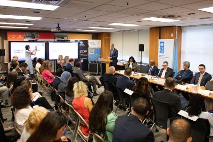 Women and men sitting at an event