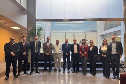 Women and men standing together for a group photo