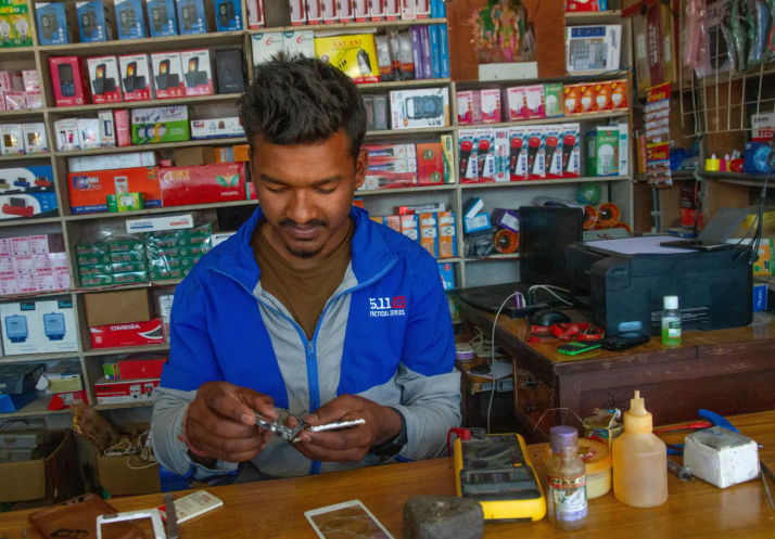 A man repairing a mobile