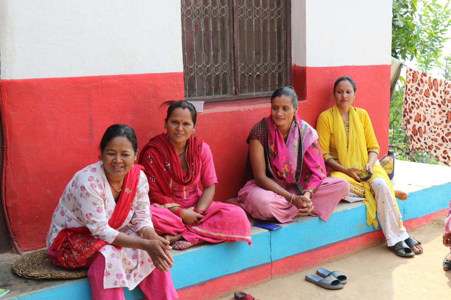 Women sitting together in a rural area