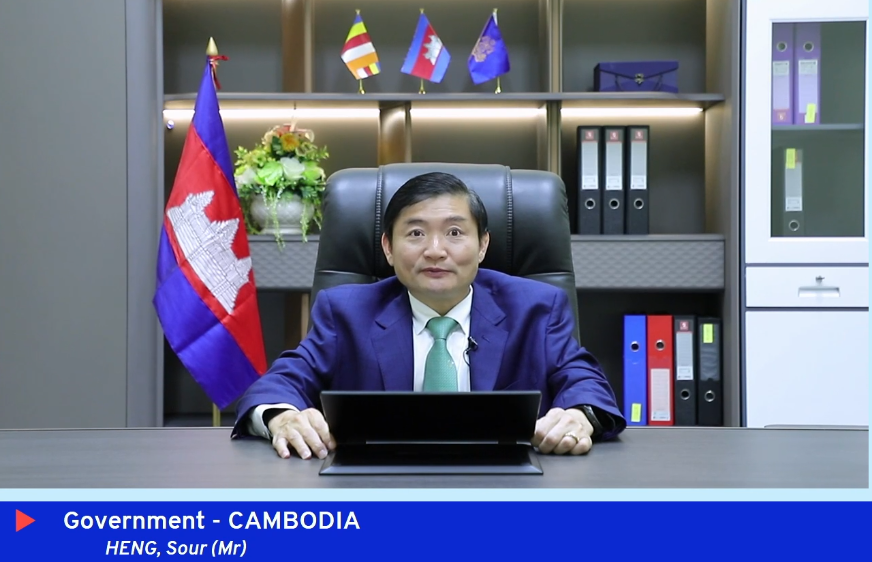 Man giving a speech at his desk