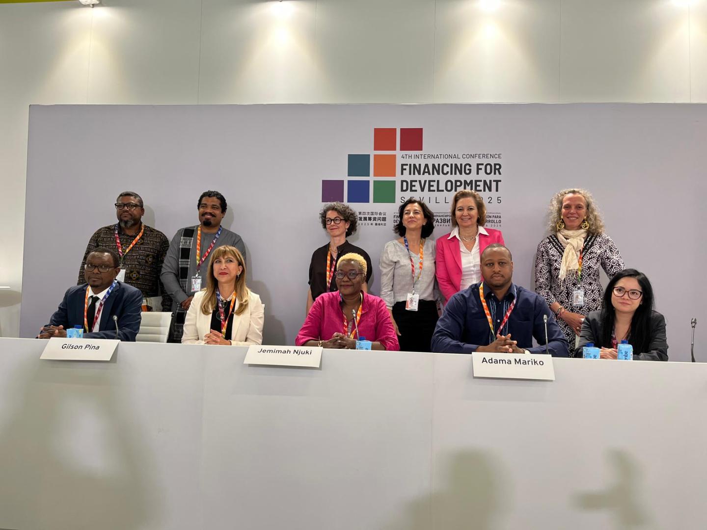 Women and men at the dais 