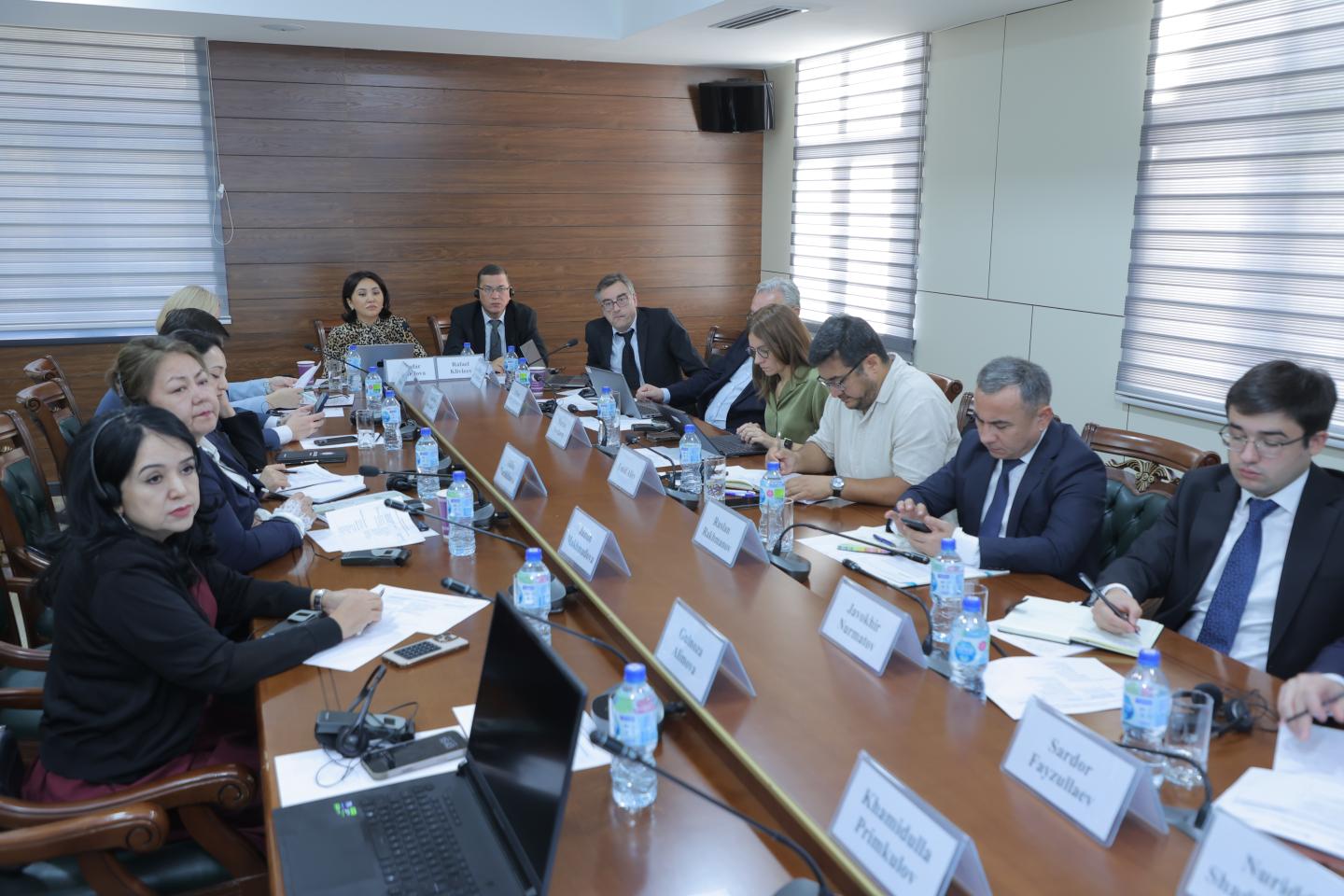 Women and men sitting together for a roundtable discussion