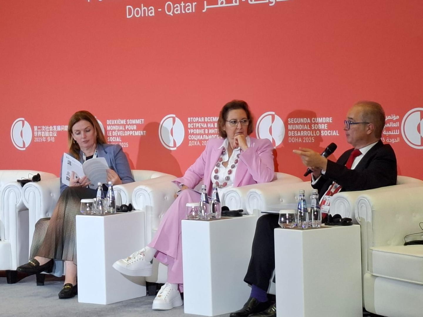 Women and men at a dais 