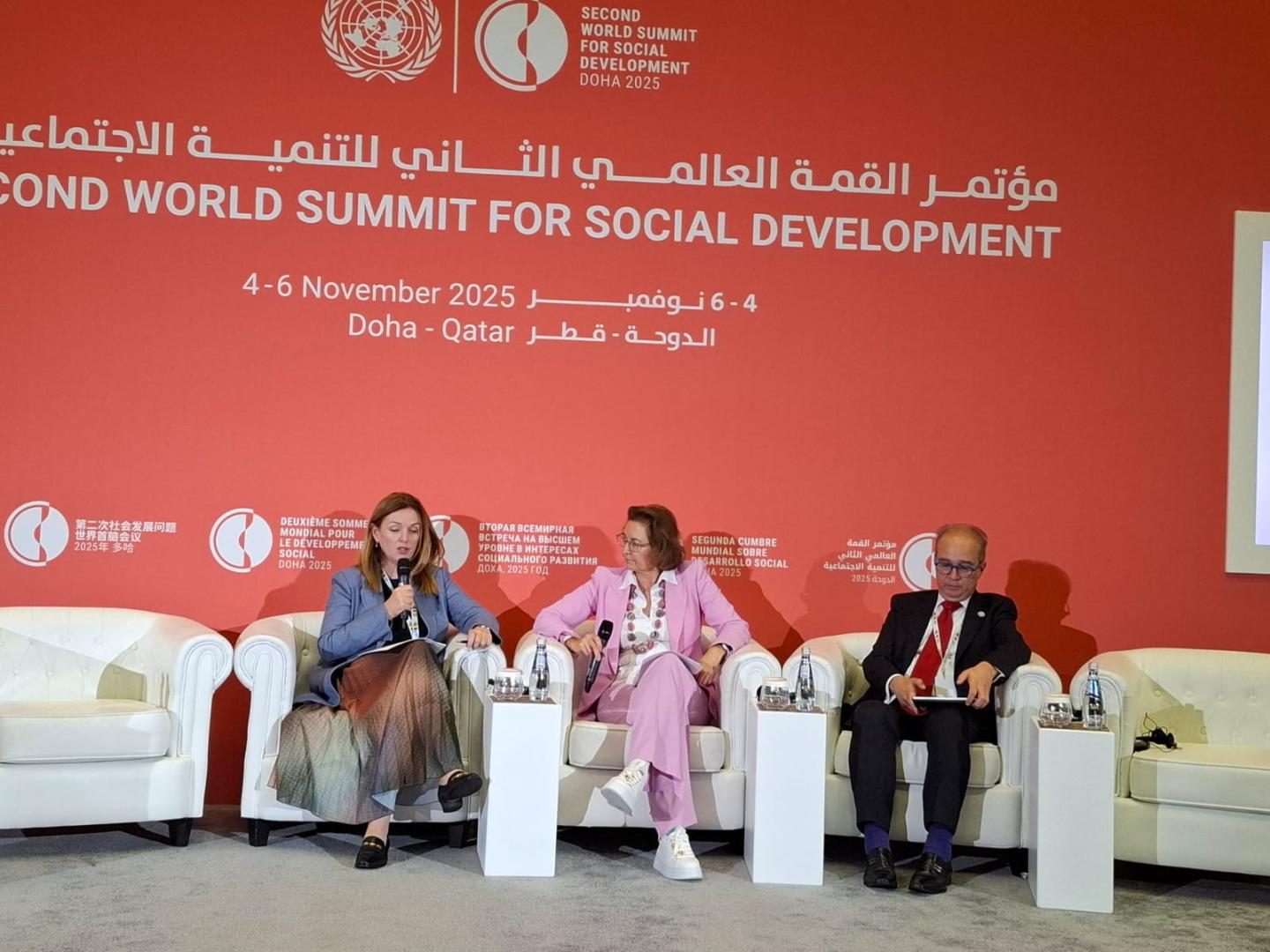 Women and men at a dais 