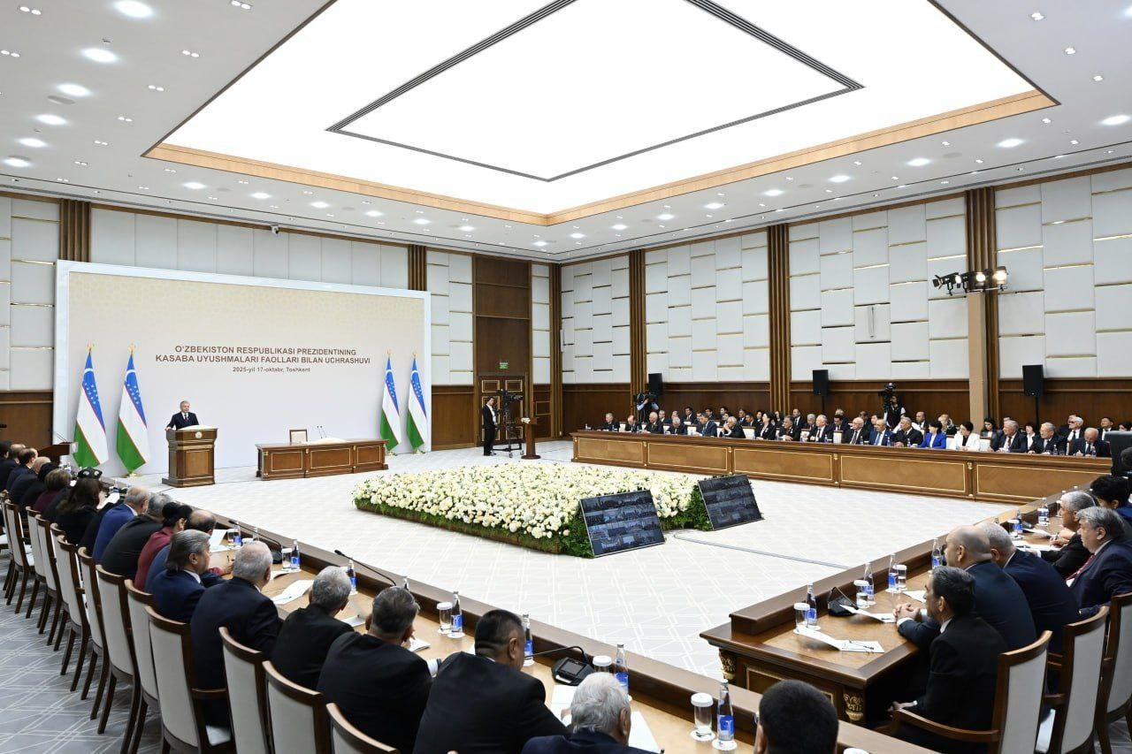 Man addressing a large conference hall