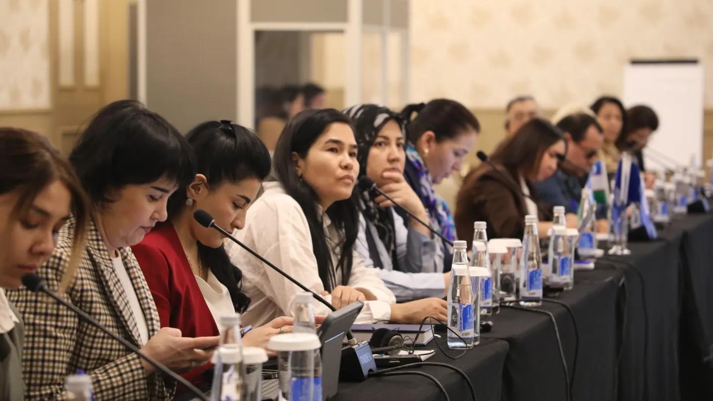 Women and men in a conference 