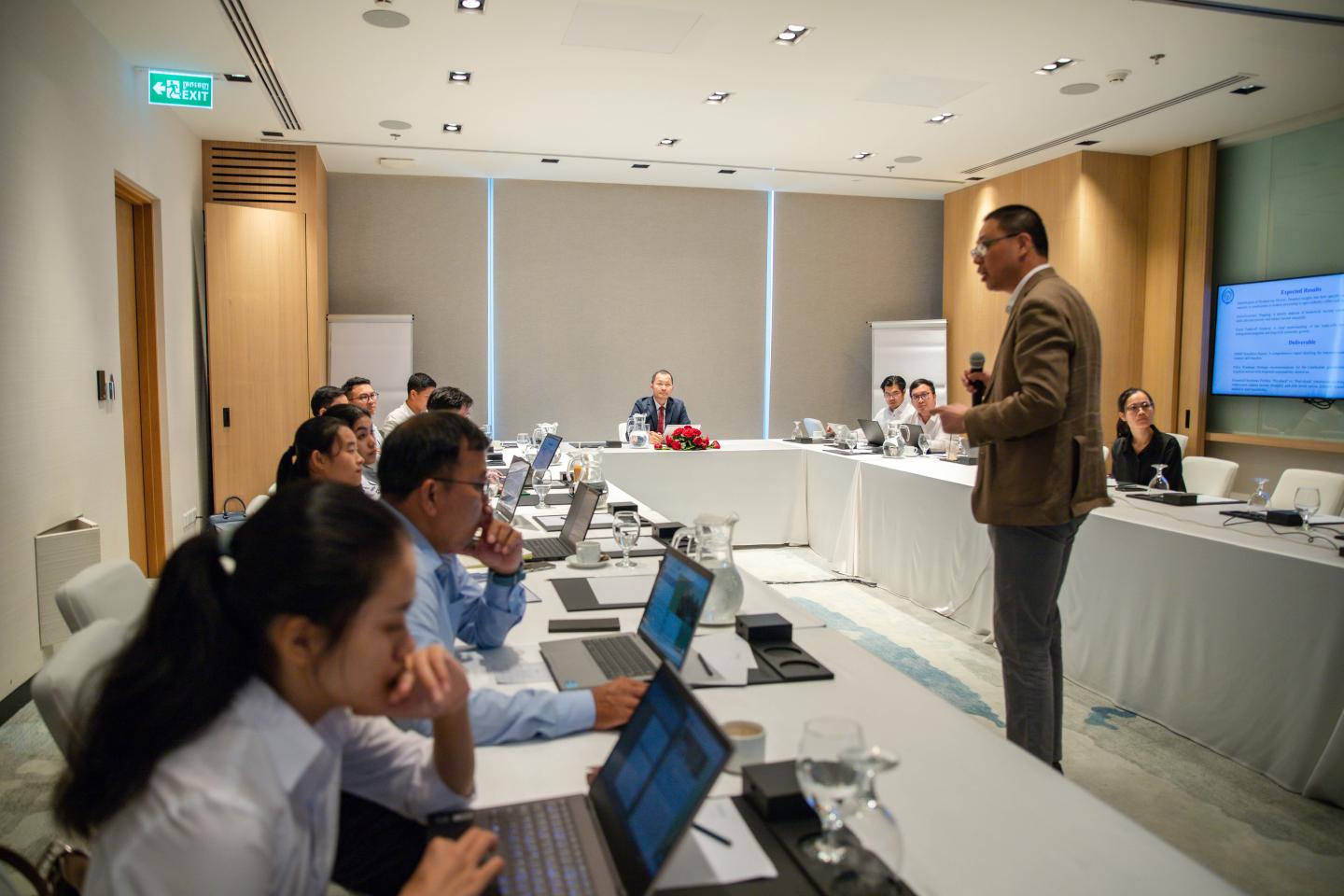 Man giving a training to seated participants