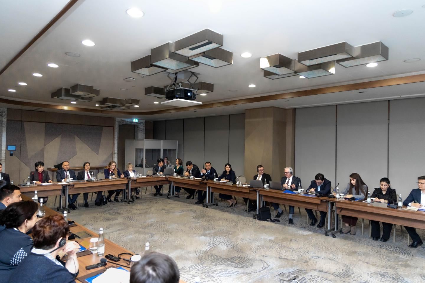 Women and men in a conference room setup