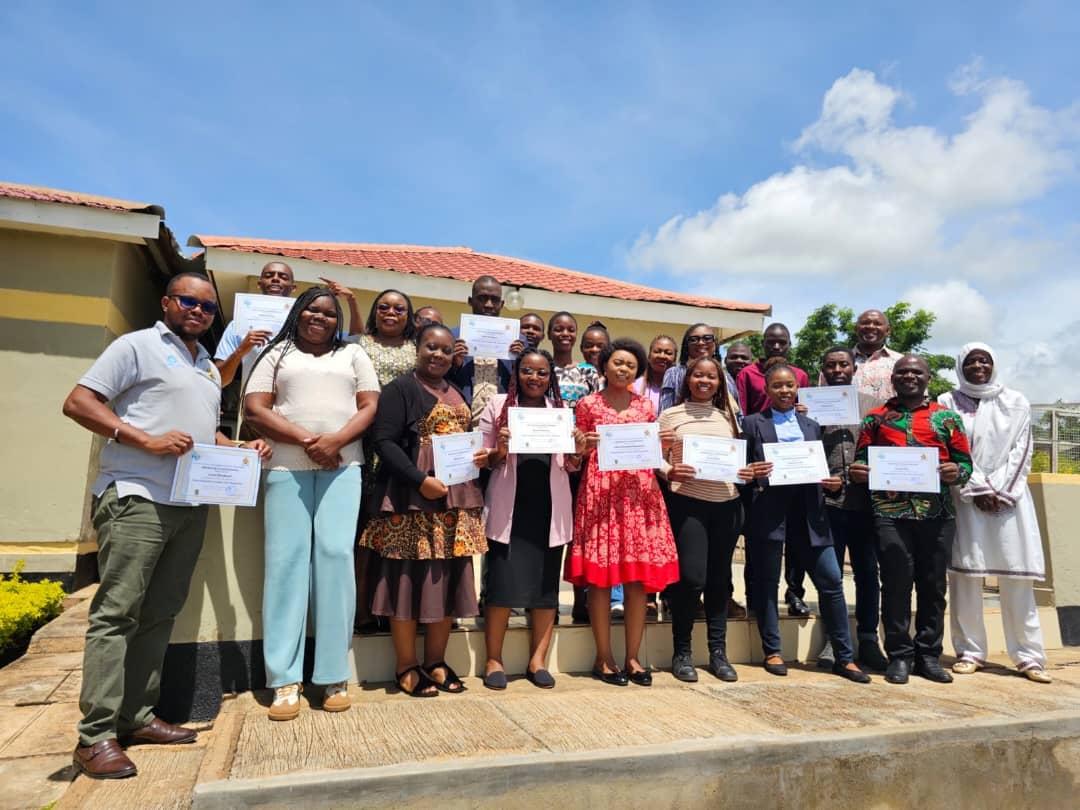 Women and men standing together outdoors 