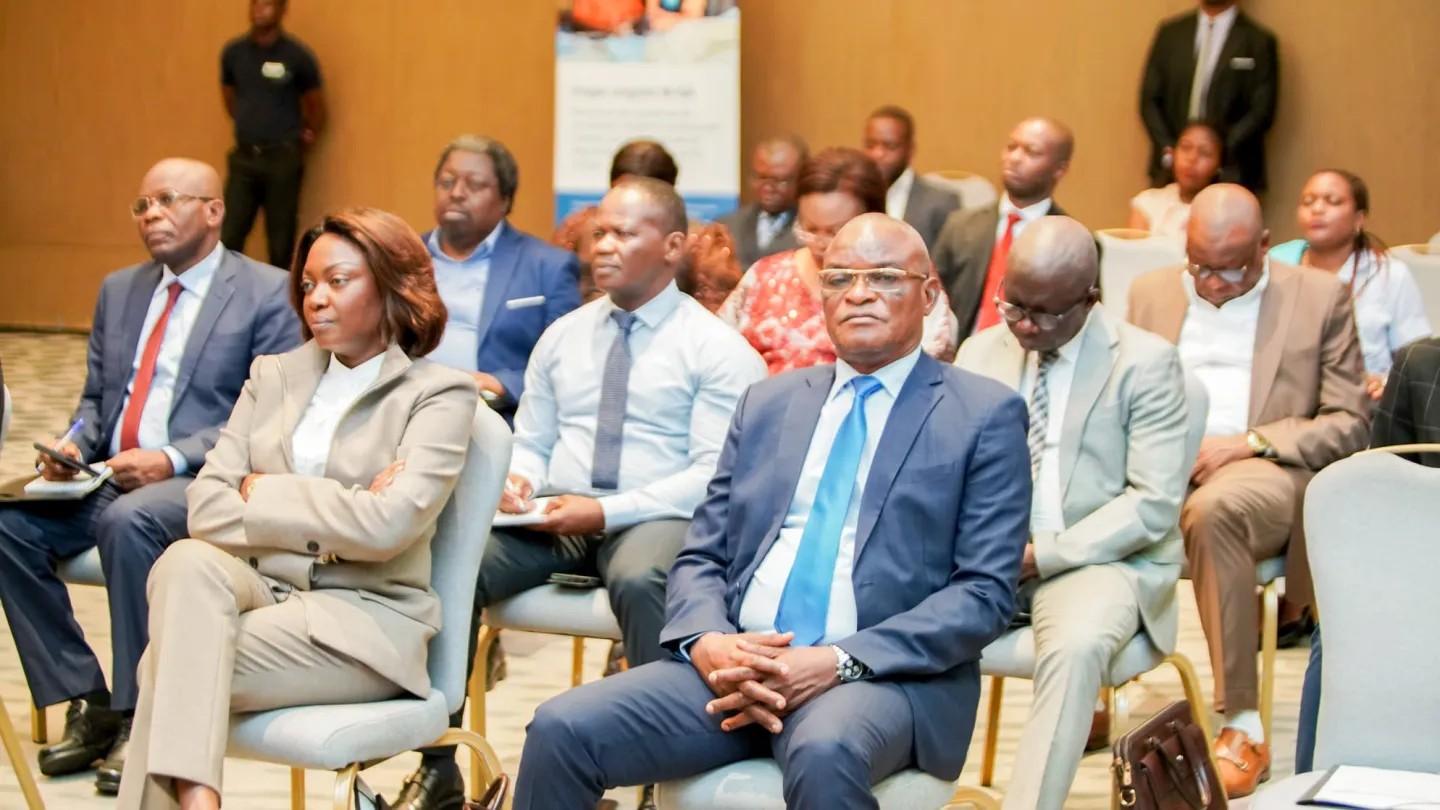 Women and men sitting at the project launch event