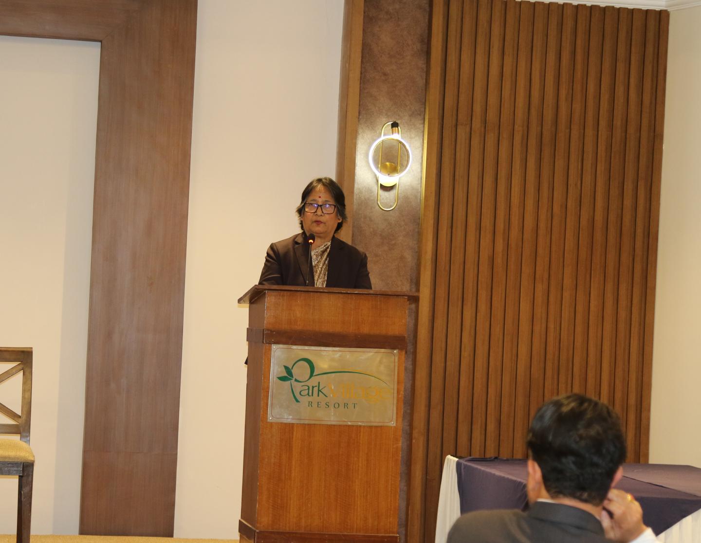 Woman standing at a podium