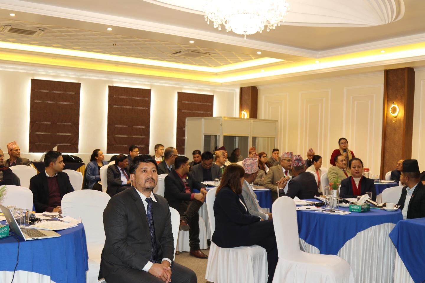 Women and men in a conference hall 