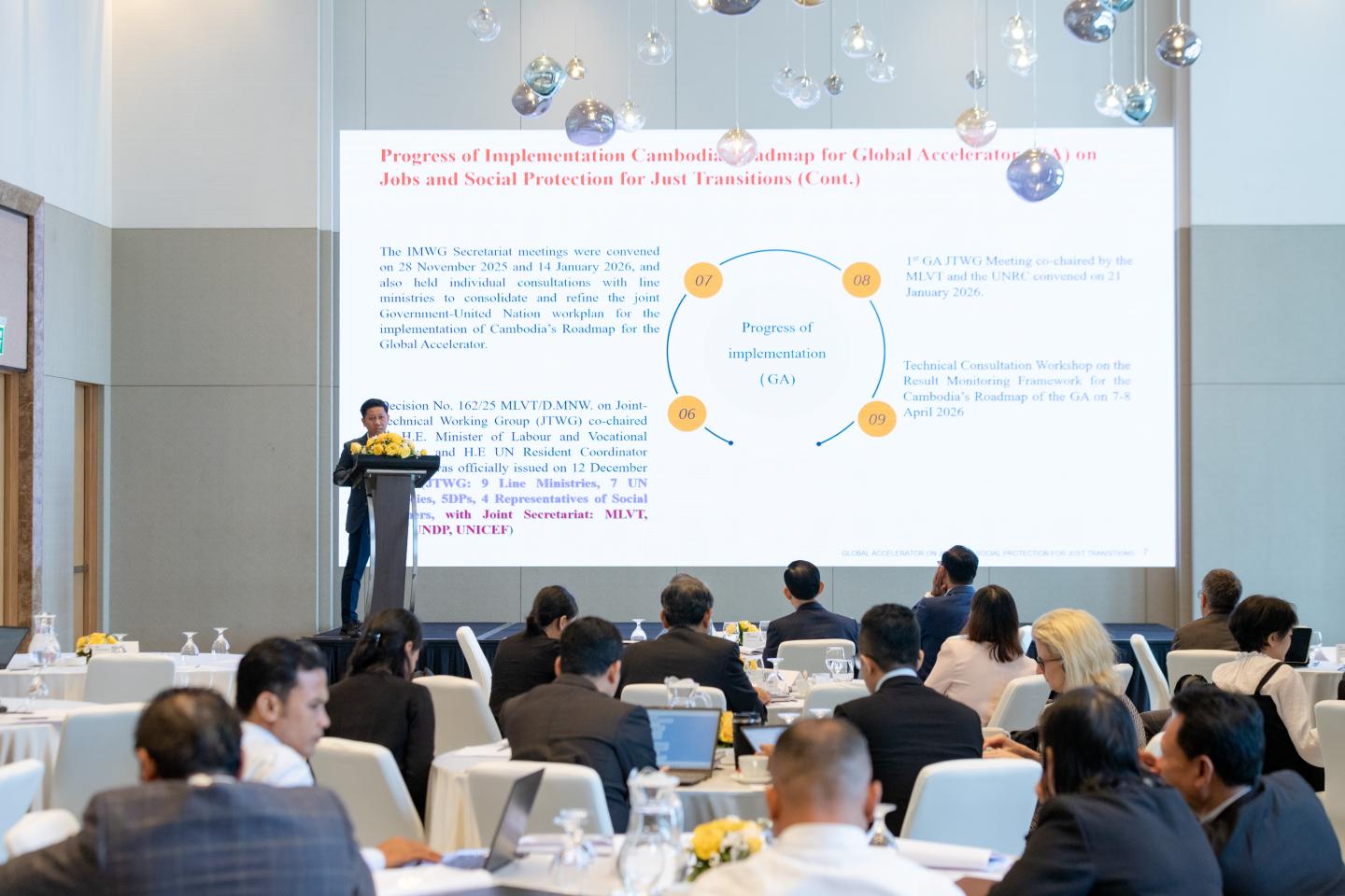 Man giving a presentation to the meeting 