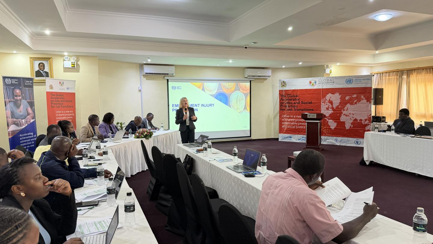 A group of people sitting around a roundtable at a meeting