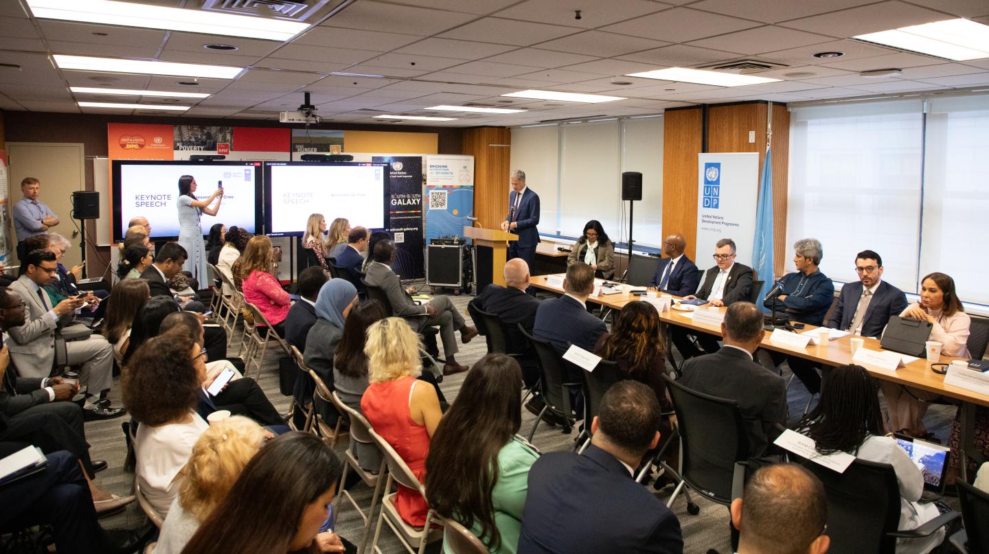 Women and men sitting at an event