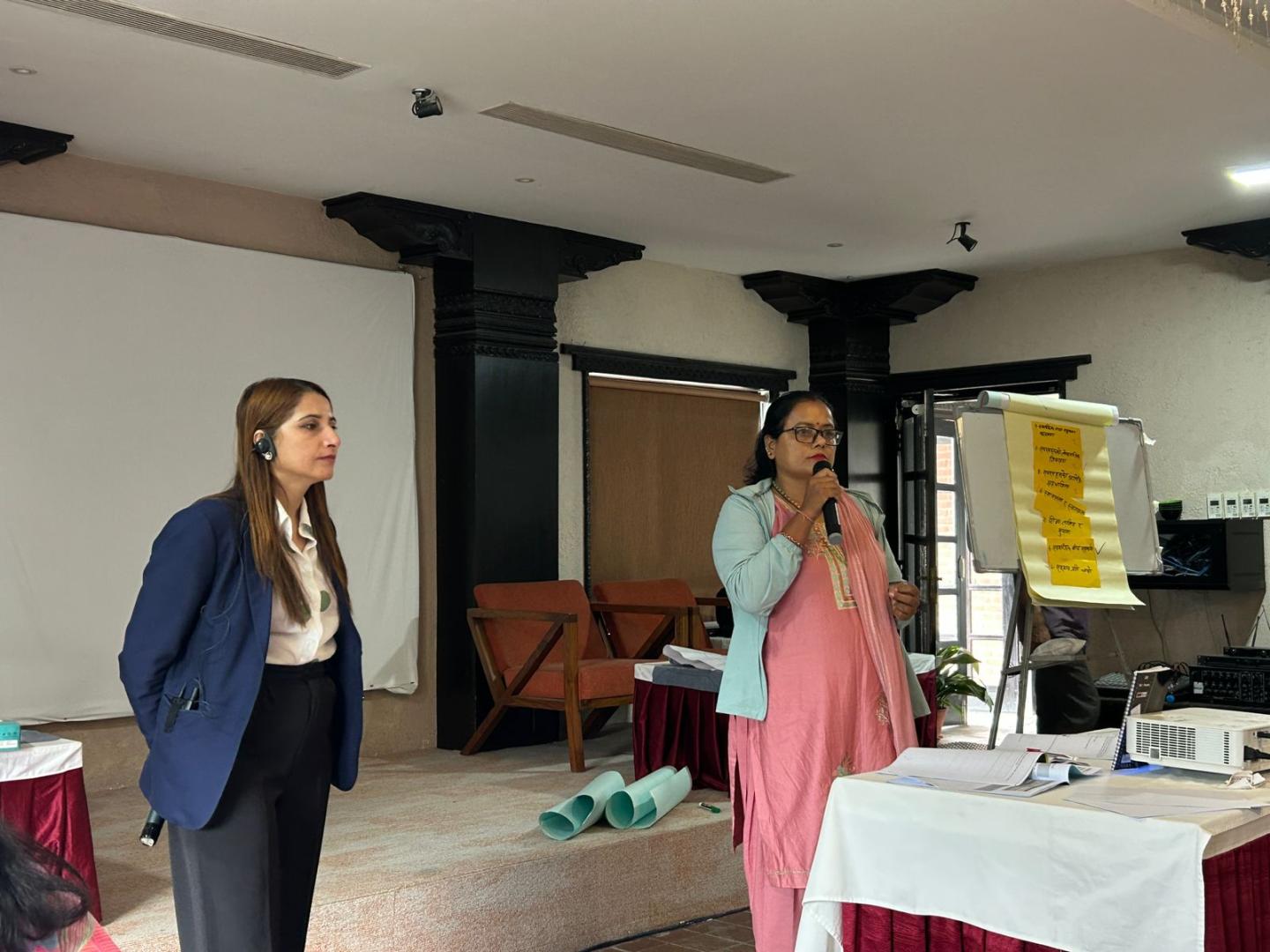 Two women conducting a training