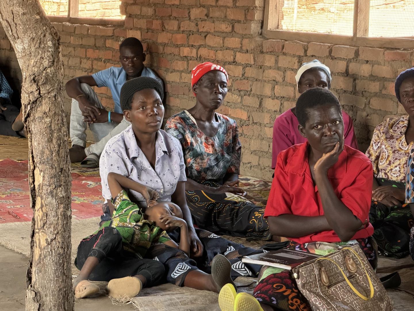 Women and men sitting down together