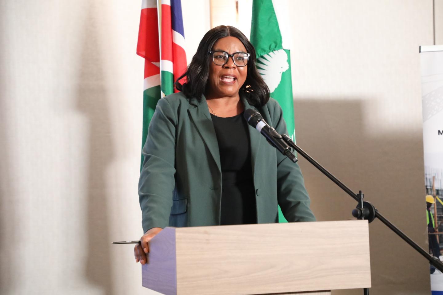Woman speaking behind a podium