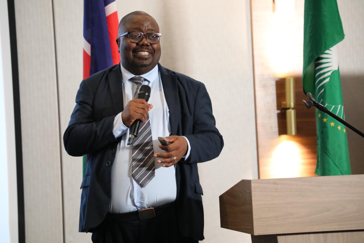 Man speaking at a meeting