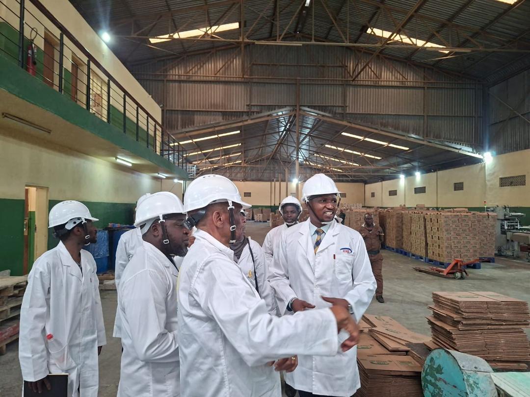Workers in a factory with safety equipment